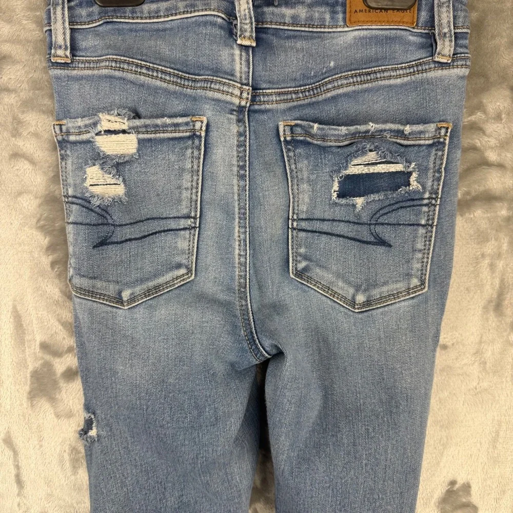 American Eagle Super Hi-Rise Jegging Distressed Blue Jeans Next Level Stretch 0